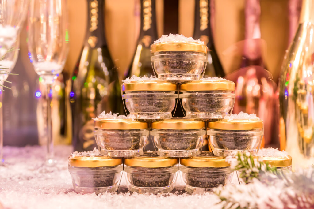 black caviar and champagne in shop window. christmas and new ear