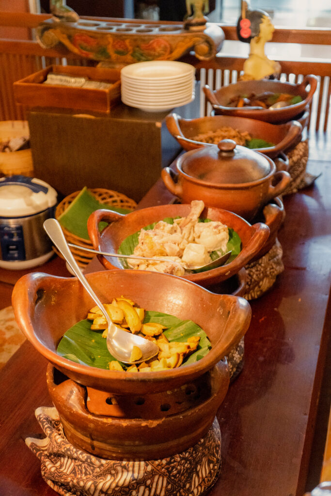 table with bowls food including shrimp shrimp other food