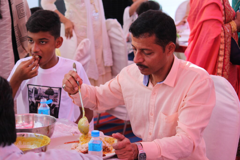 The Role of Structure in Creating Stress Free Traditional Events man eating food while sitting wedding ceremony