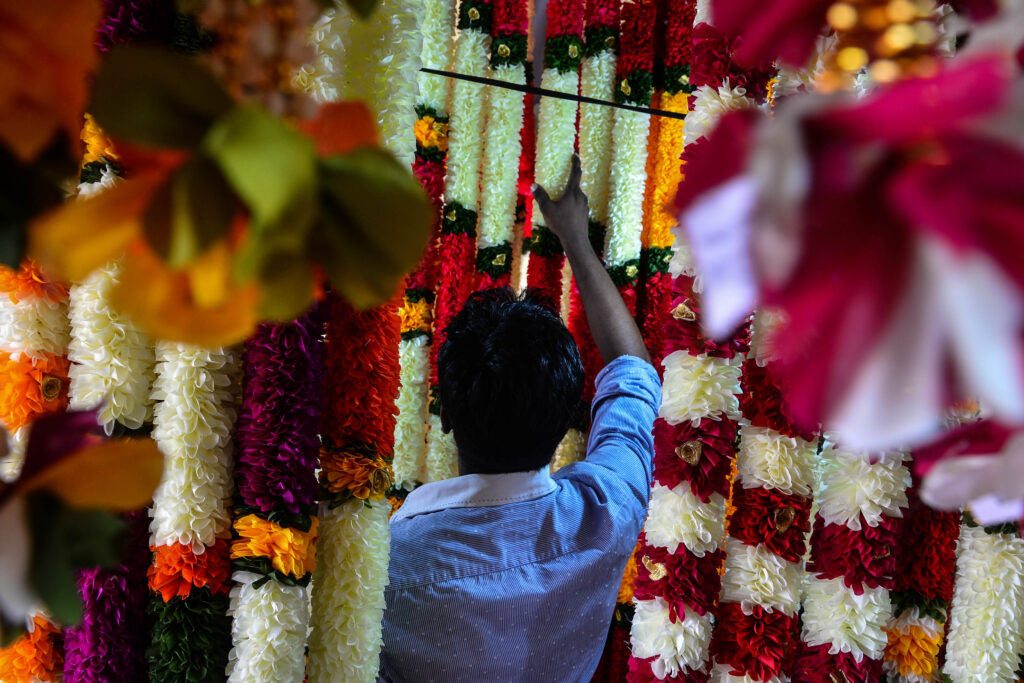 rear view man standing flower store